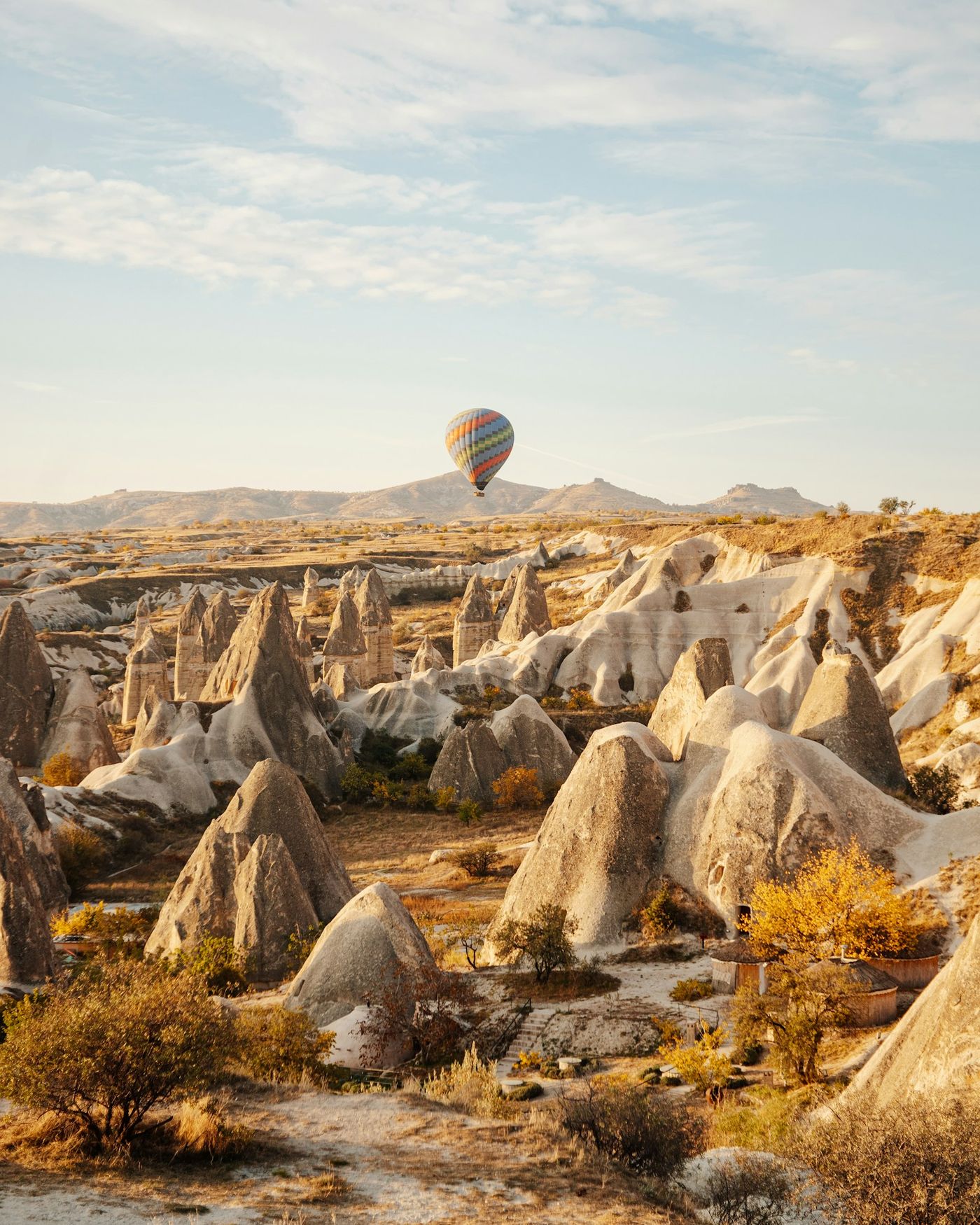 A single hot-air balloon over the rock formations of Cappadocia
