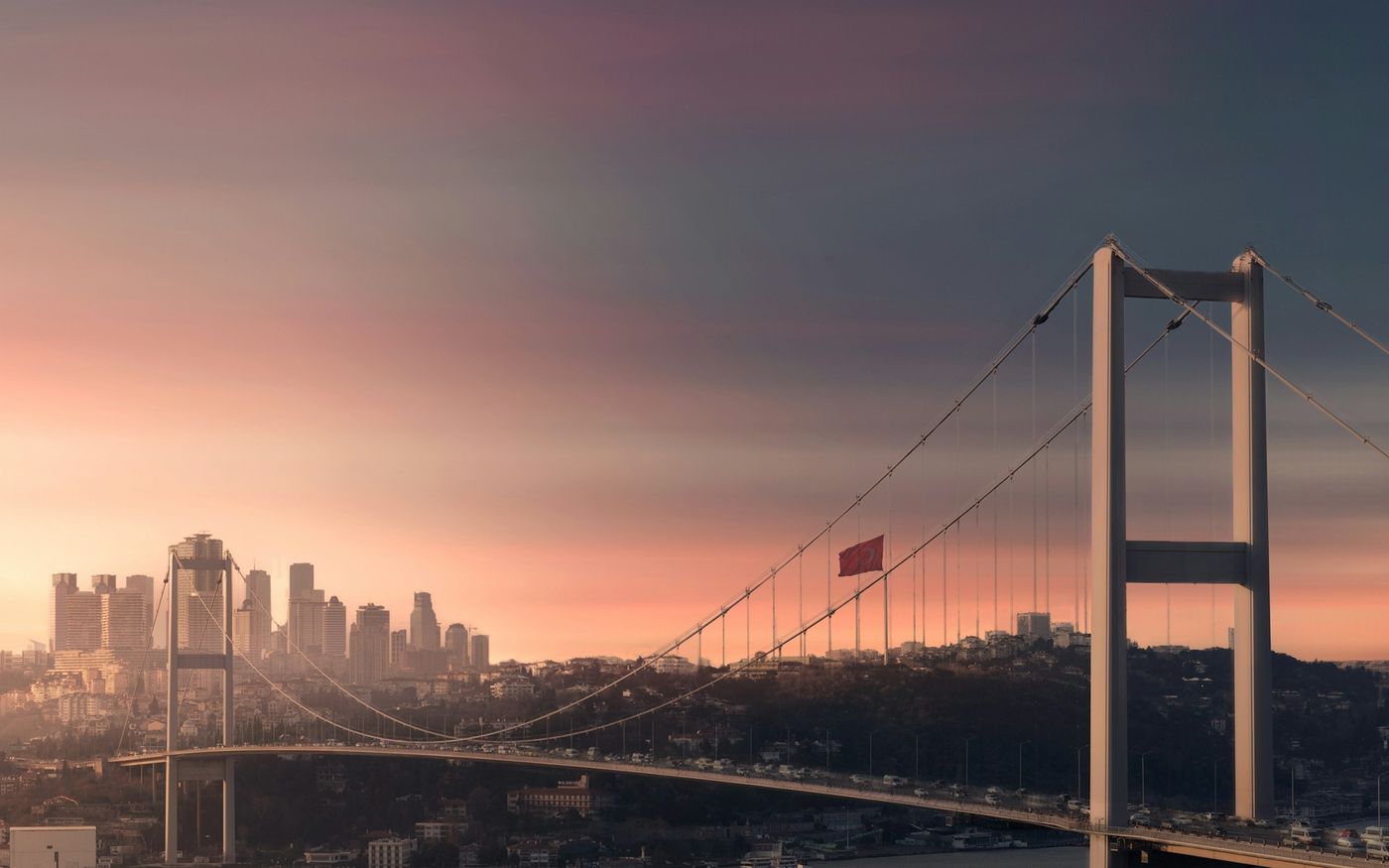 The Bosphorus bridge and the Istanbul skyline at sunset
