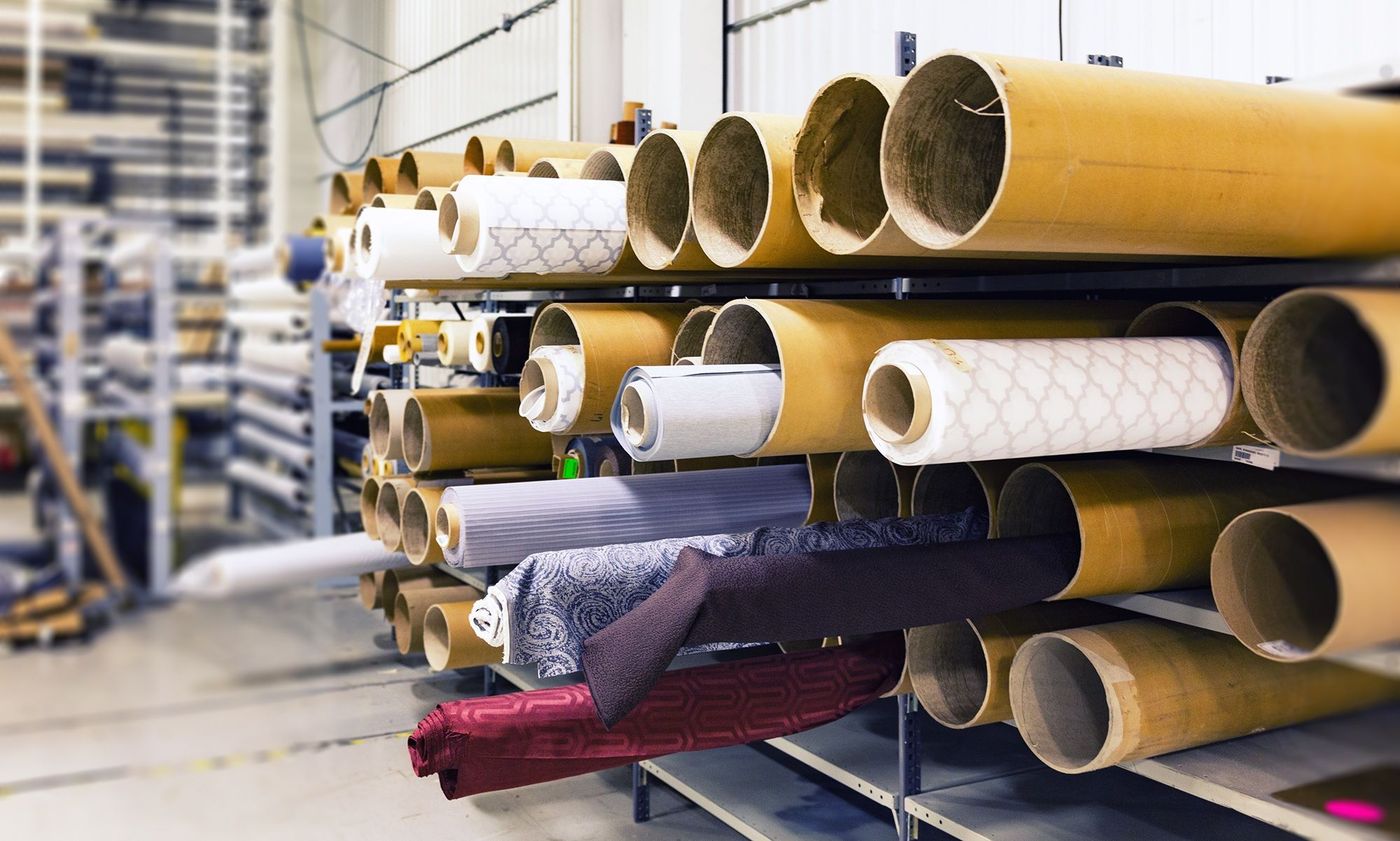 Rolls of paper stored on a rack